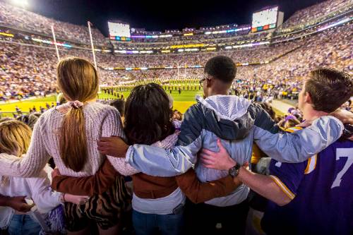 LSU students sing the alma mater at a football game